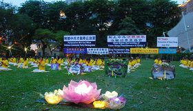 Ɖ，新加坡法轮功学员在芳林公园烛光悼念被中共迫害致死的大陆同修'