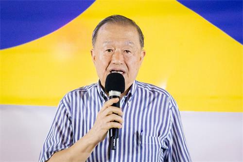 '图13：台湾投资中国受害者协会理事长高为邦上台发言。'